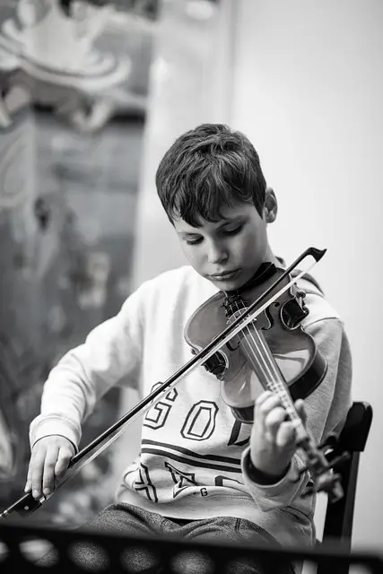 Young student practicing violin